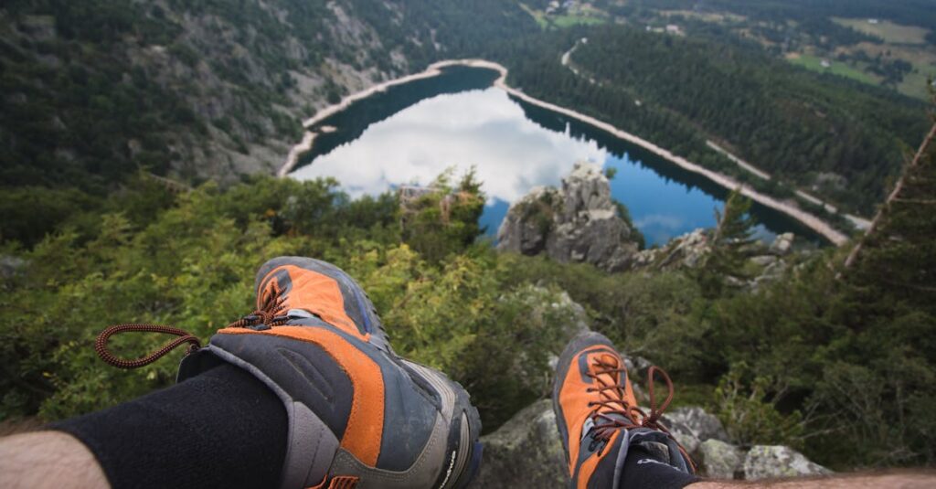 Man Sitting on Rock Looking at Lake